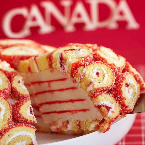 Happy Canada Day celebration cupcakes on red cake stand with red and white  maple leaf flag against a rustic distressed wood back Stock Photo - Alamy